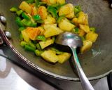 A picture of step 2 of Potatoes And capsicum veg.