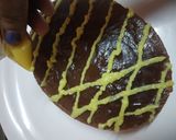 A picture of step 6 of Yakult Tripe layered choco custard biscuit cake.