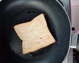 A picture of step 2 of Beans on scrambled egg on toast.