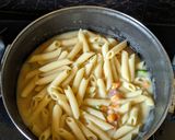A picture of step 4 of Penne pasta in white sauce (with fresh cream and cheese).