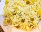 A picture of step 4 of Aloo matar ki tehari.