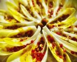 Foto del paso 3 de la receta: Barquitas de endivia con granada y cremoso de frutos secos a la cúrcuma y curry
