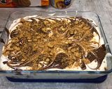 A picture of step 9 of Vanilla bean ice cream with ginger biscuits, caramel and chocolate.