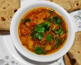 A picture of step 6 of Shakarkand ki sabzi with roti/phulka.