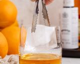 A picture of step 1 of Bulleit Old Fashioned Cocktail.