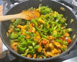 A picture of step 16 of Chicken and Bacon with Peppers, Tomatoes, Spices, and Coconut Milk.
