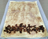 Foto del paso 3 de la receta: Caracolas hojaldradas de canela, pasas y miel en airfryer