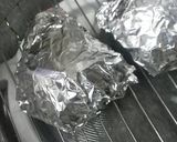 A picture of step 2 of Easy Cheesy Baked Potatoes with Hotdog Sausages.