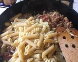 A picture of step 6 of Pasta with Spicy Sausage, Sun-dried Tomatoes & Basil.