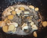 A picture of step 3 of Hong Kong Chicken with light and dark Soy Sauce.