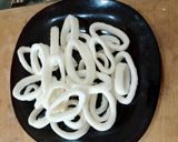 A picture of step 1 of Calamari Rings with Spiced Breadcrumbs and Arugula.