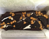 A picture of step 10 of Easy No-Bake Oreo Chocolate Cake.