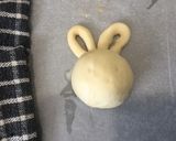 A picture of step 7 of Easter bunny milk rolls with red bean.