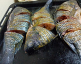 A picture of step 4 of Turmeric fried fish.