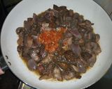 A picture of step 1 of White rice,palm oil stew and veg.sauce.