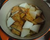 A picture of step 2 of Basic Japanese Simmered Daikon and Fish Cakes.