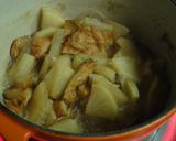A picture of step 4 of Basic Japanese Simmered Daikon and Fish Cakes.