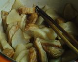 A picture of step 5 of Basic Japanese Simmered Daikon and Fish Cakes.