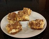 A picture of step 19 of Caramel Coconut Cheesecake Bars.