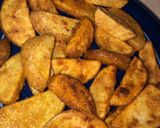 A picture of step 3 of Copycat KFC potato wedges.
