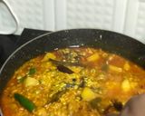 A picture of step 5 of Muri Ghonto: Bengali Yellow Rice with Fish Head.