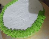 A picture of step 14 of Cricket 🏏 theme cake.