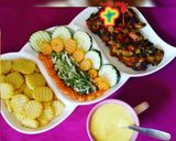 A picture of step 13 of Fried potato, chicken sauce and salad.
