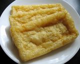 A picture of step 1 of Stir-fried Spring Onion & Abura-age (Fried Thin Tofu).