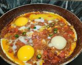 A picture of step 6 of KHAGINA (a savoury egg dish).