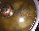 A picture of step 4 of Fish peepered soup garnish with parsely.