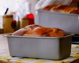 A picture of step 14 of Mini and Cute Cocoa Marble Bread | used two loaf pans.