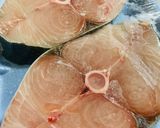 A picture of step 1 of Baked Tilapia Fish served with rocket leaves.