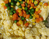 A picture of step 2 of Noodles with some veggies and egg.