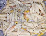 A picture of step 7 of Italian white sauce pasta.