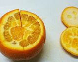 A picture of step 1 of How to Cut a Navel Orange.