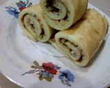 A picture of step 8 of Crepe egg roll.