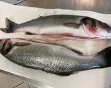 Une image de l'étape 2 de Bars farcis oseille, persil, ail et oignon grillés à la plancha.