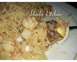 A picture of step 5 of Indomie with potato and dried fish.