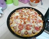 A picture of step 5 of Choma sausage pizza.