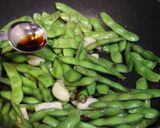 A picture of step 5 of Spicy Garlic Sautéed Edamame.