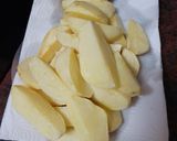 Foto del paso 3 de la receta: Lubina al horno sobre cama de cebolla, papas y tomates cherry