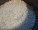 Foto del paso 4 de la receta: Tubos de calamar rellenos en salsa de tomate con arroz blanco