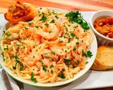 A picture of step 14 of Mike's EZ Seafood Alfredo & Roasted Garlic Spread Dinner.