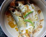 A picture of step 1 of Bhapa Parshe/ steamed parshe fish in mustard gravy.