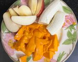 A picture of step 1 of Mango 🥭 Banana 🍌 Apple 🍎 Smoothie.