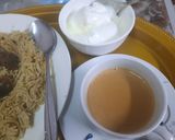 A picture of step 9 of Mutton Yakhni Pulao.  With dehi and Tea.