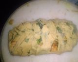 A picture of step 5 of Spinach kathi roll in fishbone wrap with red souce pasta.