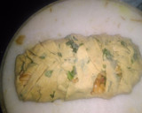 A picture of step 5 of Spinach kathi roll in fishbone wrap with red souce pasta.