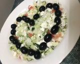 A picture of step 6 of Feta cheese salad and black olives.