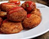 A picture of step 5 of Stuffed onion rings.